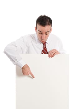 A businessman pointing to a spot the paper sign where you should look, isolated against a white background