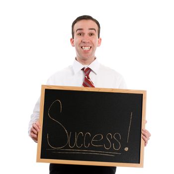 A young teacher is holding up a chalk board with the word success, isolated against a white background