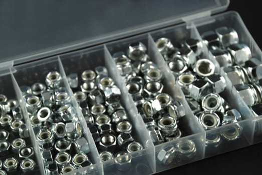 box containing several nuts and washers of different sizes