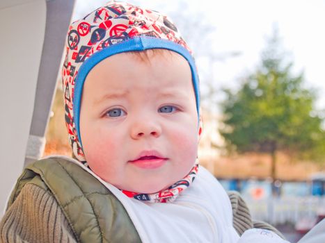 Modern lifestyle - Cute baby boy sitting in his stroller