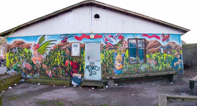 Building in Christiania , Denmark with graffiti