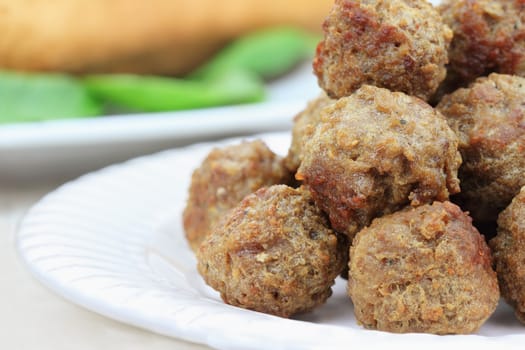 Plate of meatballs without sauce. Shallow depth of field.