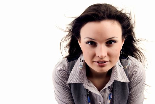 Portrait of a young beautiful brunette with the hair blowing about