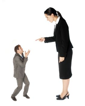 A business lady making a colleague feel small