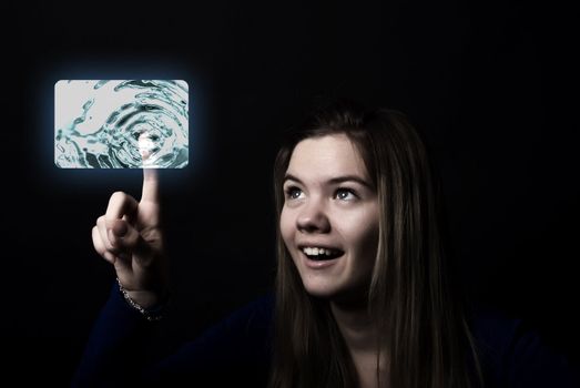 Portrait of a young beautiful girl touching digital screen