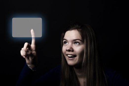 Portrait of a young beautiful girl touching digital screen