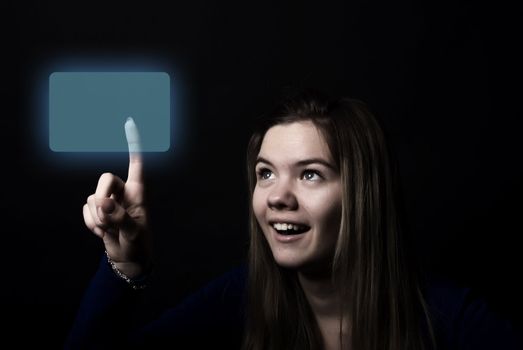 Portrait of a young beautiful girl touching digital screen