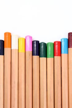 Colour pencils isolated on white background close up .