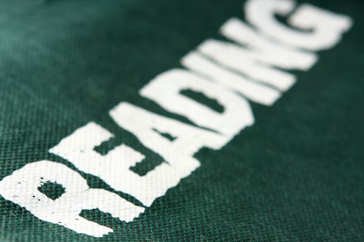 white reading word on green background 