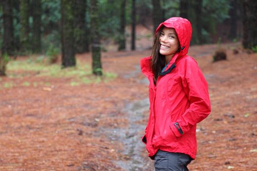 Woman smiling walking in forest on a rainy day. The forest La Esperanza, Tenerife, Canary Islands.