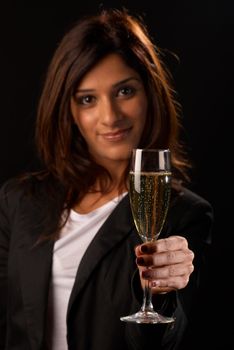 Middle eastern woman toasting with a glass of champagne