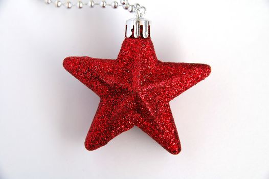 A red ornamental christmas star with white background