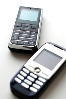 Two modern mobile phones side by side