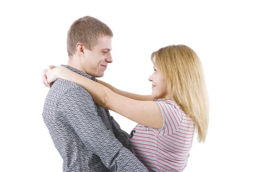 on a white background happy young couple hugging
