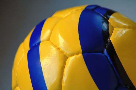 A close up view of yellow soccer ball