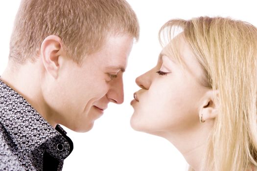 on a white background portrait of a young girl who kisses a guy

