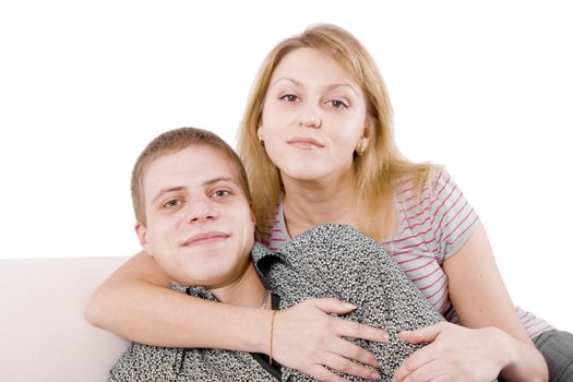 Two lovers lie on the couch. A man and a woman.
