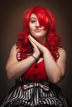 Attractive Red Haired Woman Portrait on a Grey Background.