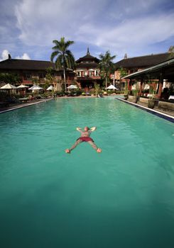 Man enjoying summer in the pool