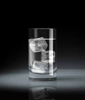 Water glass with ice block on dark background