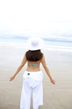 Woman enjoying the beach in Porto de Galinhas, Pernambuco, Brazil