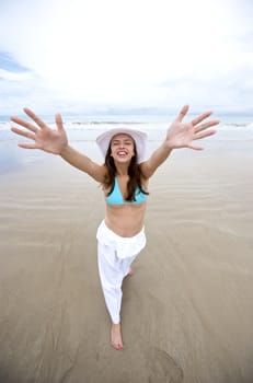 Woman enjoying the beach in Porto de Galinhas, Pernambuco, Brazil