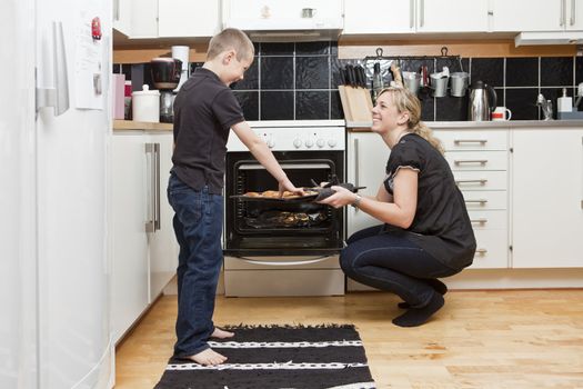 Mother and son in a kitchen situation