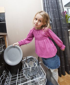 Young Girl by the Dishwasher with a plate