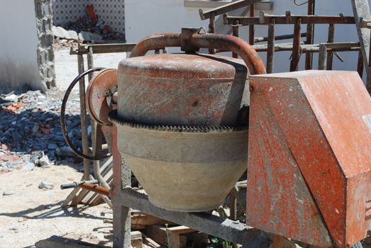 orange cement mixer at a construction site