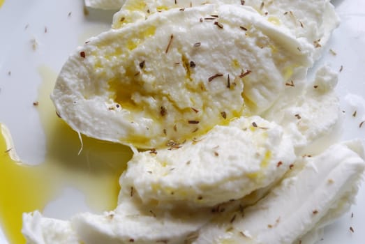 photo of mozzarella cheese and olive oil