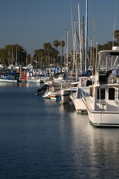 Yachts and fishing boats in a marina.