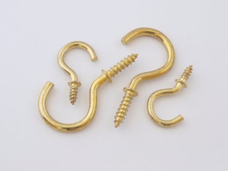 Assorted brass hookes used for hanging light objects.