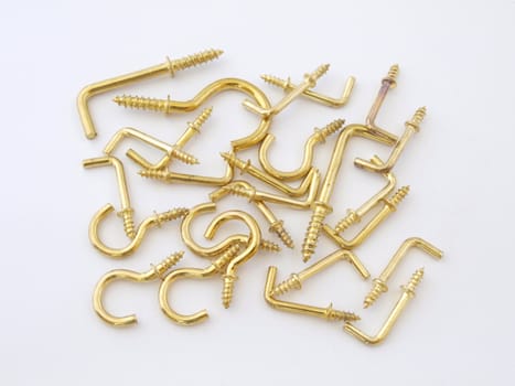 Assorted brass hookes used for hanging light objects.