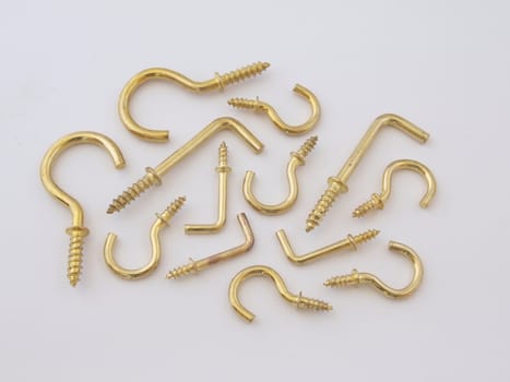 Assorted brass hookes used for hanging light objects.
