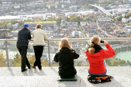  Tourists observe the top view of Bergen, Norway