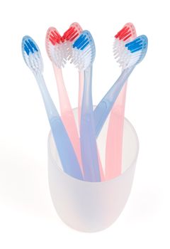 Colored toothbrush in glass. With clipping path.