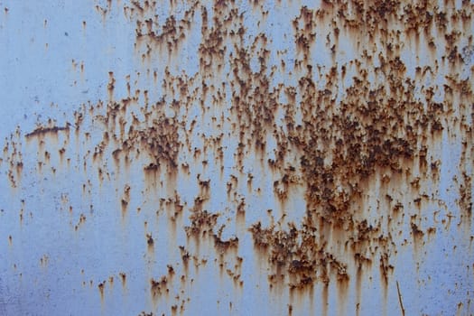 blue surface of an old fence, rusty textures