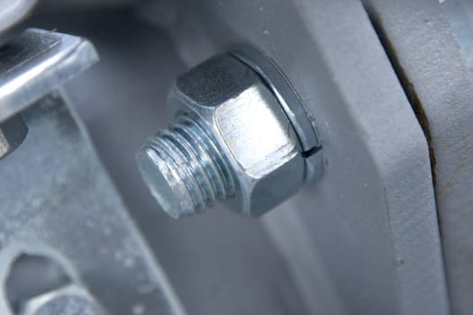 macro of nut and screw, detail from metallic construction