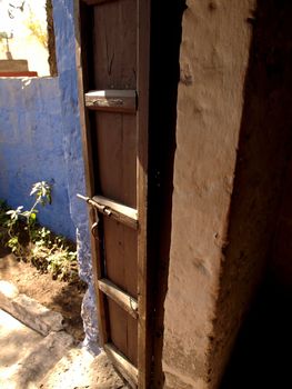 Old, open door in antique monastery