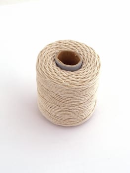 Ball of string or twine on a plain white background.