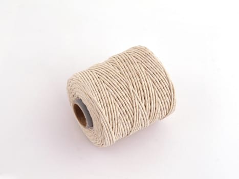 Ball of string or twine on a plain white background.