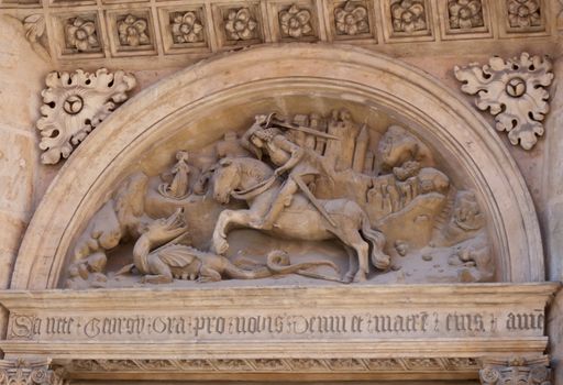 Carving of George and the dragon above church door in Prague