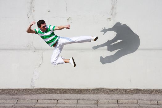 man fighting against his own shadow