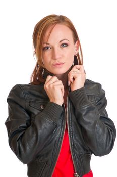 Pretty brunette wearing a leather jacket and a red dress.