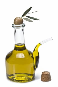 Olive oil bottles and olives isolated on a white background.