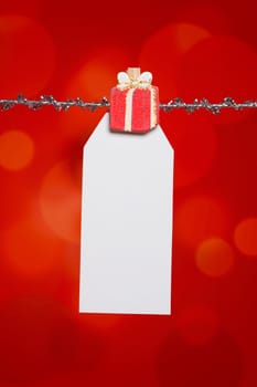Christmas or birthday gift tag on red background