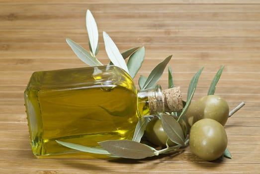 Olive oil bottles on a bamboo mat.