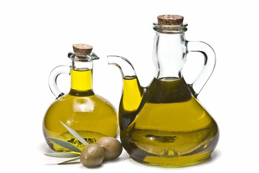 Olive oil bottles and olives isolated on a white background.