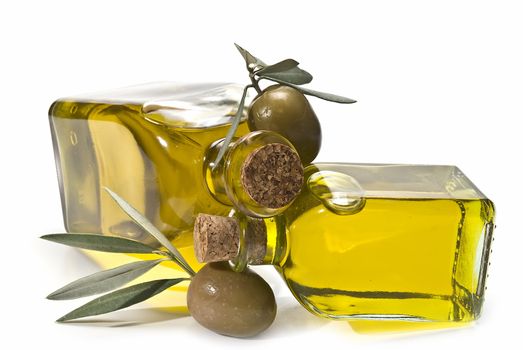 Olive oil bottles and olives isolated on a white background.