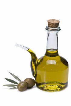 Olive oil bottles and olives isolated on a white background.